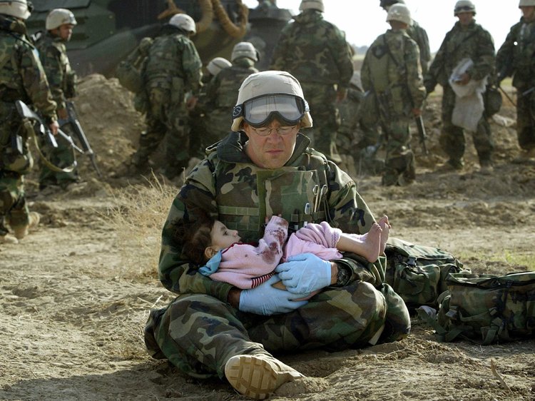 US-navy-holding-child